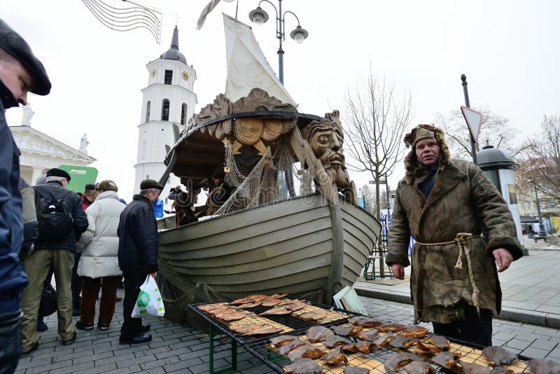 Unidentified people trades the smoked fish in annual traditional crafts fair - Kaziuko fair on Mar 1, 2013 in Vilnius, Lithuania. Unidentified people trades the smoked fish in annual traditional crafts fair - Kaziuko fair on Mar 1, 2013 in Vilnius, Lithuania