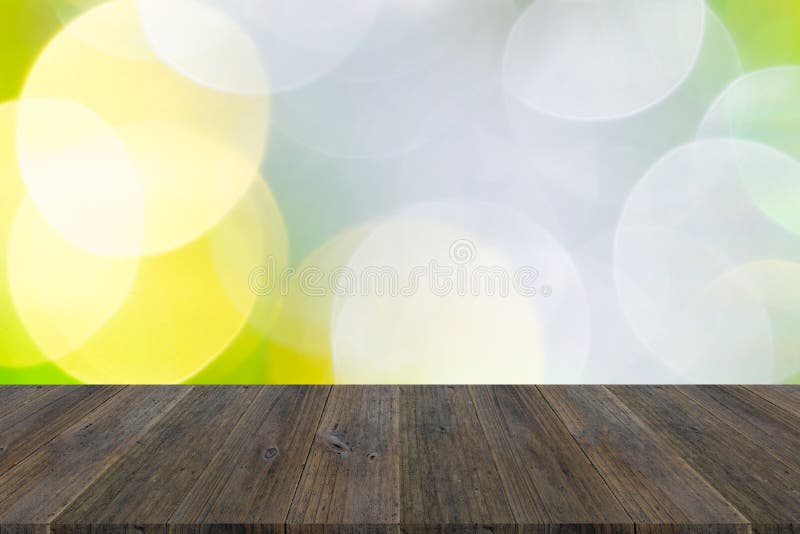 Περίληψη bokeh του φωτός με το ξύλινο πεζούλι. Αφηρημένο υπόβαθρο bokeh του φωτός για το νέο έτος εορτασμού και των Χριστουγέννων με το ξύλινο πεζούλι