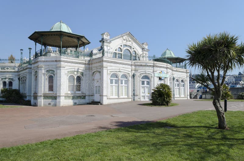 Torquay Pavilion seen before redevelopment. The Pavilion is built on a concrete platform weighing some 1,000 tons, on land which is partly reclaimed from the sea. The facing stoneware is Doulton's carrara enamelled. Torquay Pavilion seen before redevelopment. The Pavilion is built on a concrete platform weighing some 1,000 tons, on land which is partly reclaimed from the sea. The facing stoneware is Doulton's carrara enamelled.