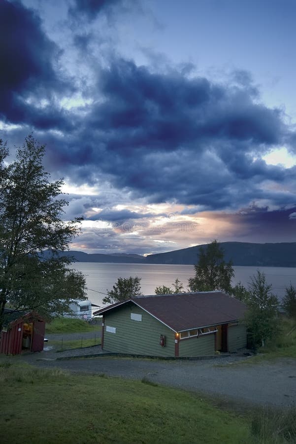 A camp site at Sognefjorden, Norway. Sogn og Fjordane county, sunset sky. A camp site at Sognefjorden, Norway. Sogn og Fjordane county, sunset sky.