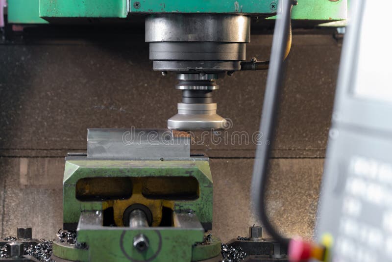 Spindle with a milling cutter in a mandrel on a CNC milling machine. Spindle with a milling cutter in a mandrel on a CNC milling machine.