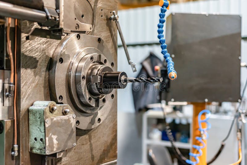 Spindle with a drill on a mandrel of a CNC machine. Spindle with a drill on a mandrel of a CNC machine.