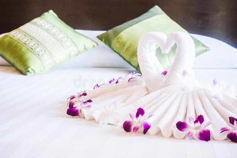 Romantic concept for background with Swan towel on bed decoration in bedroom interior - Vintage light Filter. Romantic concept for background with Swan towel on bed decoration in bedroom interior - Vintage light Filter