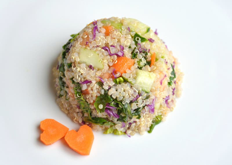 Vegan dish : quinoa salad with carrot, spinach, cabbage and cucumber . A vegetarian source of proteins . Vegan dish : quinoa salad with carrot, spinach, cabbage and cucumber . A vegetarian source of proteins .