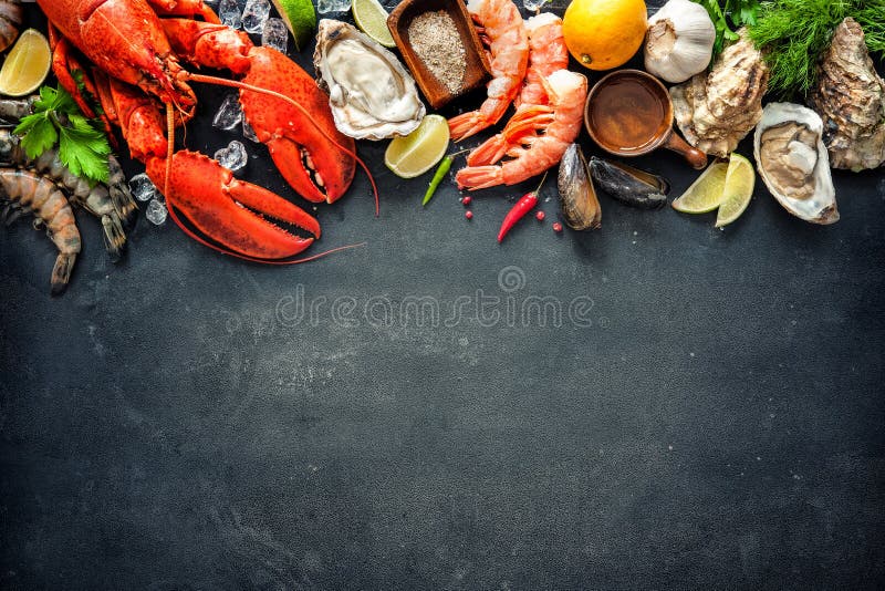 Shellfish plate of crustacean seafood with fresh lobster, mussels, oysters as an ocean gourmet dinner background. Shellfish plate of crustacean seafood with fresh lobster, mussels, oysters as an ocean gourmet dinner background