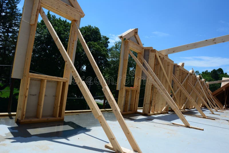 Framing starts on the top floor of an inn in Middlesex County Massachusetts.  The exterior wall is the first item assembled . Framing starts on the top floor of an inn in Middlesex County Massachusetts.  The exterior wall is the first item assembled