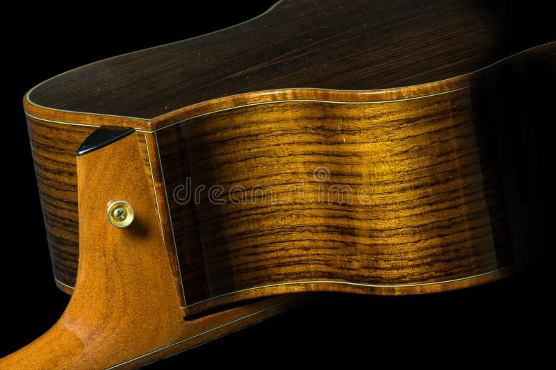 Here is the side and neck joint of a rosewood body acoustic guitar with koa bindings, and mahogany neck. Here is the side and neck joint of a rosewood body acoustic guitar with koa bindings, and mahogany neck