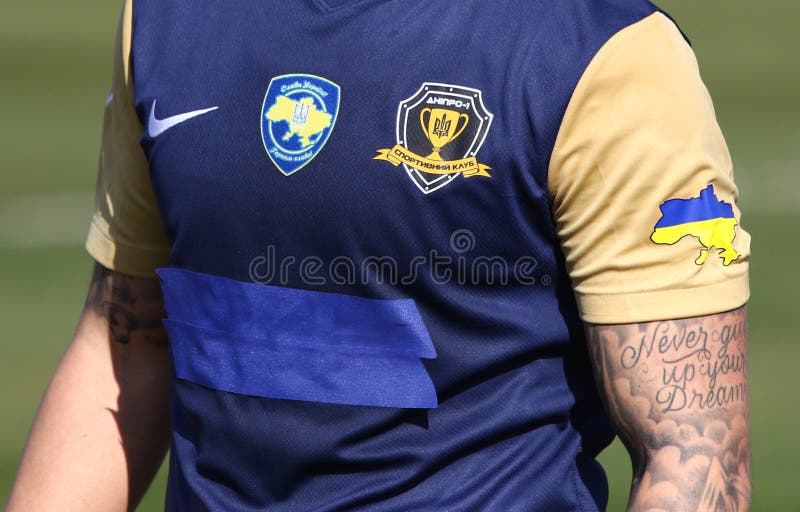 Uzhhorod, Ukraine - March 12, 2023: Close-up front side of SC Dnipro-1 player t-shirt (jersey) with team and sponsors logos seen during the VBET Ukrainian Premier League game SC Dnipro-1 v Dynamo Kyiv. Uzhhorod, Ukraine - March 12, 2023: Close-up front side of SC Dnipro-1 player t-shirt (jersey) with team and sponsors logos seen during the VBET Ukrainian Premier League game SC Dnipro-1 v Dynamo Kyiv