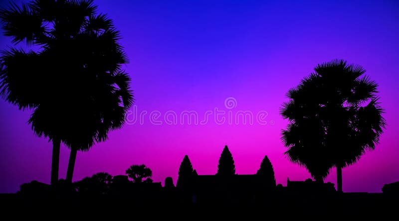 Sunrise Purple temple facade silhouette Palm trees of the UNESCO Angkor Wat temple in Angkor Archaeological Park near Siem Reap in Cambodia. Sunrise Purple temple facade silhouette Palm trees of the UNESCO Angkor Wat temple in Angkor Archaeological Park near Siem Reap in Cambodia.