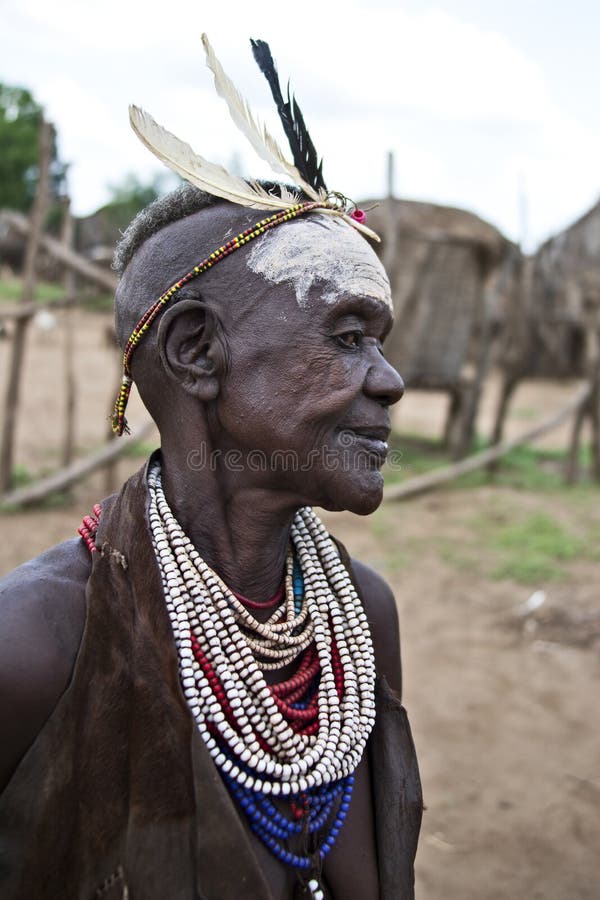 The Karo, or Kara, are a Nilotic ethnic group in Ethiopia famous for their body painting. They are also one of the smallest tribes in the region with an estimated population of 1.000-1.200 people. They are closely related to their neighbors, Hamer and Banna, with a lexical similarity of 81 They live along the east banks of the Omo River in southern Ethiopia and survive on agriculture and natural annual flooding. They have had the same culture and traditions for 500 years, like traditional dancing and painting their bodies with a mix of ash and fat or water.The Karo people differentiate themselves from many of the neighbouring tribes by excelling specifically in body and face painting. They paint themselves daily with coloured ochre, white chalk, yellow mineral rock, charcoal, and pulverized iron ore, all natural resources local to the area. The specific designs drawn on their bodies can change daily and vary in content, ranging from simple stars or lines to animal motifs, such as guinea fowl plumage, or to the most popular – a myriad of handprints covering the torso and legs. Both the Karo and the Hamar men use clay to construct elaborate hairstyles and headdresses for themselves, signifying status, beauty, and bravery.The photo is part of the album `SECOND ETHIOPIAN TRIBES EXPEDITION`. The Karo, or Kara, are a Nilotic ethnic group in Ethiopia famous for their body painting. They are also one of the smallest tribes in the region with an estimated population of 1.000-1.200 people. They are closely related to their neighbors, Hamer and Banna, with a lexical similarity of 81 They live along the east banks of the Omo River in southern Ethiopia and survive on agriculture and natural annual flooding. They have had the same culture and traditions for 500 years, like traditional dancing and painting their bodies with a mix of ash and fat or water.The Karo people differentiate themselves from many of the neighbouring tribes by excelling specifically in body and face painting. They paint themselves daily with coloured ochre, white chalk, yellow mineral rock, charcoal, and pulverized iron ore, all natural resources local to the area. The specific designs drawn on their bodies can change daily and vary in content, ranging from simple stars or lines to animal motifs, such as guinea fowl plumage, or to the most popular – a myriad of handprints covering the torso and legs. Both the Karo and the Hamar men use clay to construct elaborate hairstyles and headdresses for themselves, signifying status, beauty, and bravery.The photo is part of the album `SECOND ETHIOPIAN TRIBES EXPEDITION`