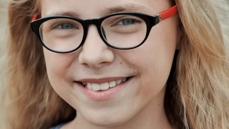 Portrait of a young smiling 11 year old girl with glasses. Portrait of a young smiling 11 year old girl with glasses