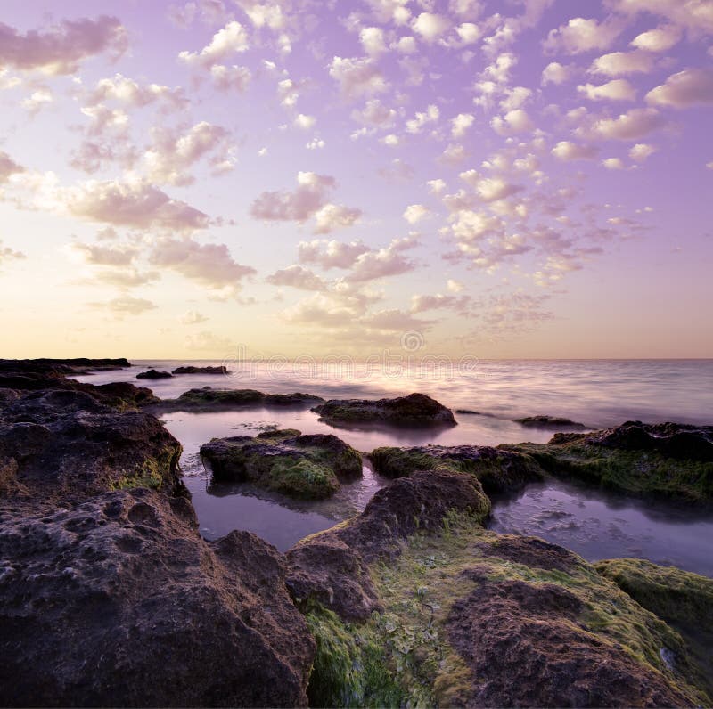 Beautiful purple colors wild rocky lagoon at tranquil ocean and with autumn sky above. Crop image as you wish (according to 2 3 rule) !. Beautiful purple colors wild rocky lagoon at tranquil ocean and with autumn sky above. Crop image as you wish (according to 2 3 rule) !