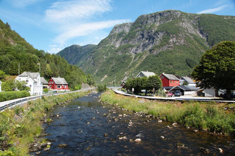 Cold river and small village in Norway near Sognefjord. Cold river and small village in Norway near Sognefjord