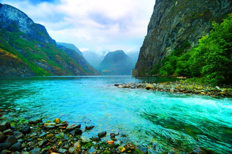 Scenic view of Sognefjord, Norway. A river flowing in a fjord. Scenic view of Sognefjord, Norway. A river flowing in a fjord.