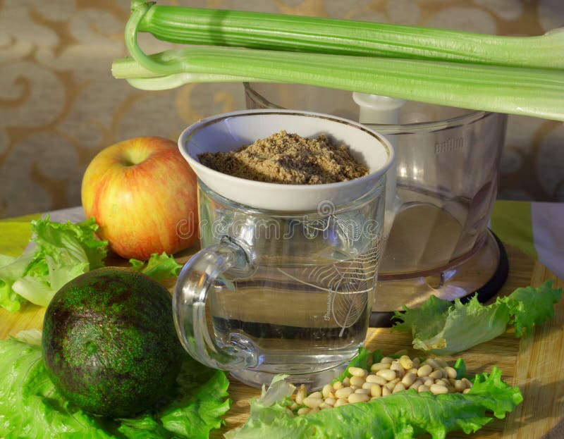 green, nutritious, healthy cocktail lettuce and celery, avacado and apple, pine nuts and flax seed flour. green, nutritious, healthy cocktail lettuce and celery, avacado and apple, pine nuts and flax seed flour