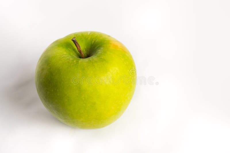 Green apple on a white background Isolated. Great for concept layouts about ftiness, well being, healthy, nature and so. Green apple on a white background Isolated. Great for concept layouts about ftiness, well being, healthy, nature and so.