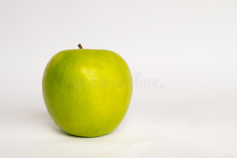 Green apple on a white background Isolated. Great for concept layouts about ftiness, well being, healthy, nature and so. Green apple on a white background Isolated. Great for concept layouts about ftiness, well being, healthy, nature and so.