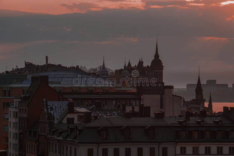 View of buildings in city against red sky. View of buildings in city against red sky