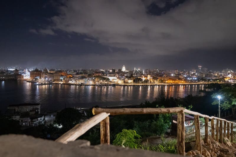 High on La Cabana Hill, above the village of Casablanca in Cuba, is the statue known as El Cristo de La Habana. High quality photo. High on La Cabana Hill, above the village of Casablanca in Cuba, is the statue known as El Cristo de La Habana. High quality photo