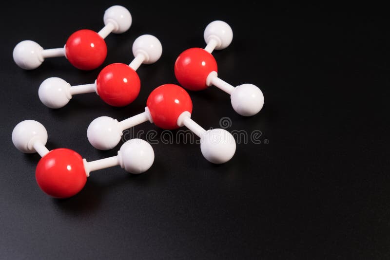 Chemistry model atom of molecule water scientific elements. Integrated particles hydrogen and oxygen atom on black background. Chemistry conceptual plastic model for education. Chemistry model atom of molecule water scientific elements. Integrated particles hydrogen and oxygen atom on black background. Chemistry conceptual plastic model for education.