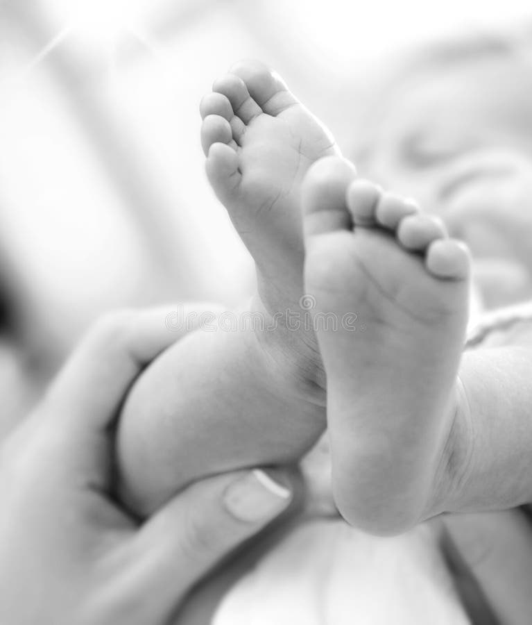 Tiny baby feet, black & white. Tiny baby feet, black & white
