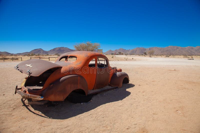 Solitaire town is a salt and clay pan surrounded by high red dunesnational parks of namibia between desert and savannah africa. Solitaire town is a salt and clay pan surrounded by high red dunesnational parks of namibia between desert and savannah africa