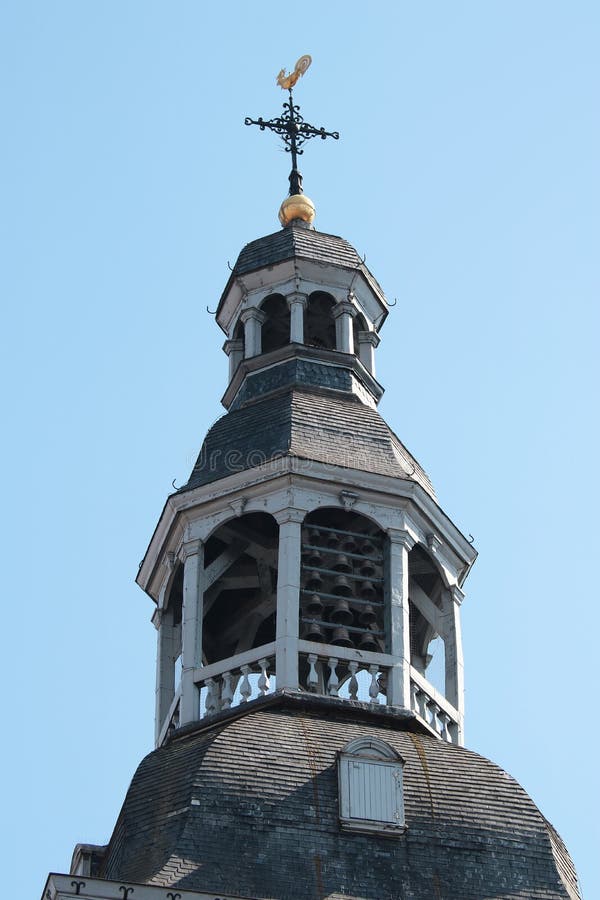 Tower with chimes and weathercock on top of it. Tower with chimes and weathercock on top of it