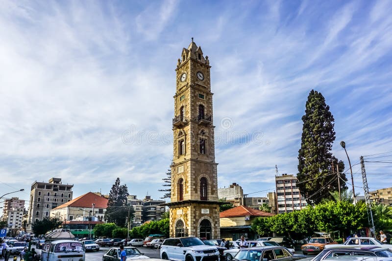 Tripoli Sultan Abdul Hamid Clock Tower with Traffic and Blue Sky Background View. Tripoli Sultan Abdul Hamid Clock Tower with Traffic and Blue Sky Background View
