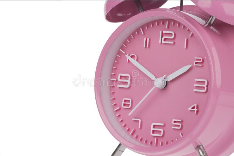 Pink alarm clock with the hands at 10 and 2 am or pm isolated on a white background. Pink alarm clock with the hands at 10 and 2 am or pm isolated on a white background