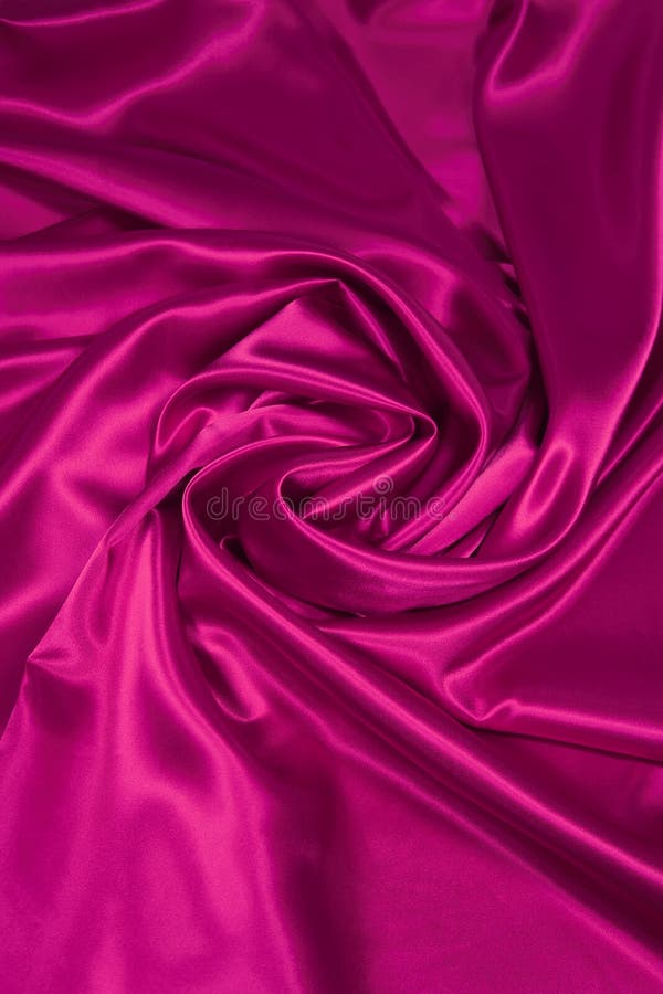Luxurious deep pink satin/silk folded fabric, useful for backgrounds. Luxurious deep pink satin/silk folded fabric, useful for backgrounds