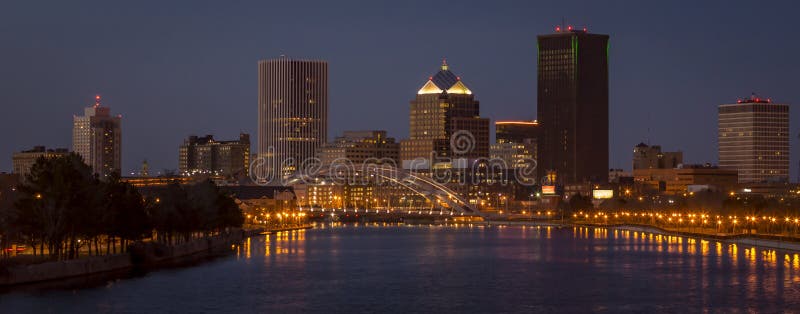 Downtown Area Rochester New York genesee river night blue hour Frederick Douglassâ€“Susan B. Anthony Memorial Bridge. Downtown Area Rochester New York genesee river night blue hour Frederick Douglassâ€“Susan B. Anthony Memorial Bridge