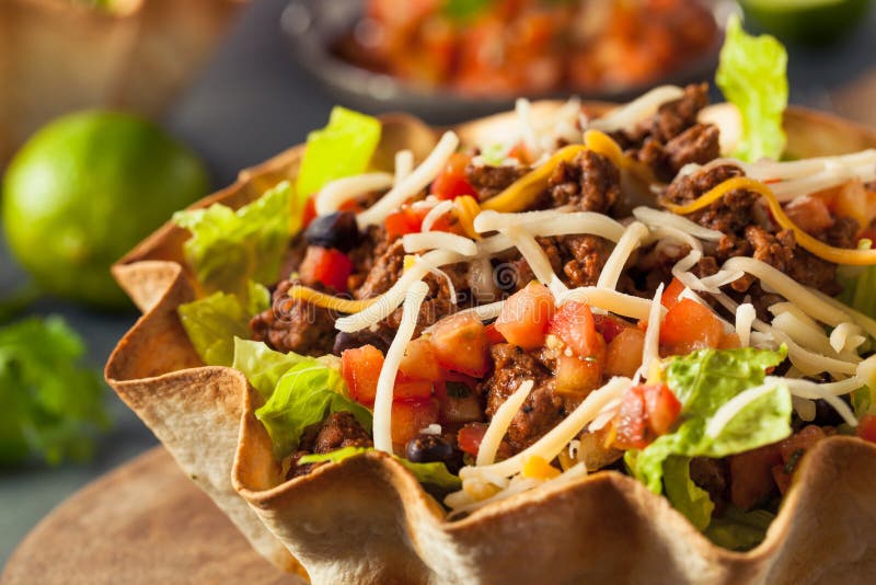 Taco Salad in a Tortilla Bowl with Beef Cheese and Lettuce. Taco Salad in a Tortilla Bowl with Beef Cheese and Lettuce