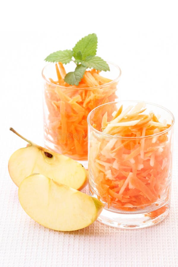 Two glasses of carrot and apple salad - healthy eating. Two glasses of carrot and apple salad - healthy eating