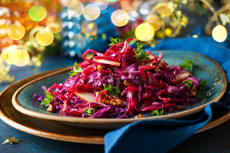 Red Cabbage salad with apples and pecan nuts for Christmas dinner. Vegetarian dish. Red Cabbage salad with apples and pecan nuts for Christmas dinner. Vegetarian dish.