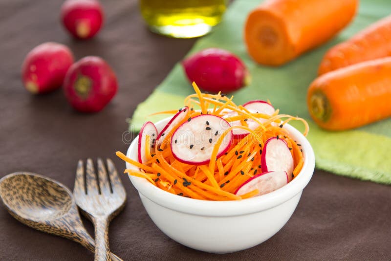 Grated carrot and radish salad with black sesame. Grated carrot and radish salad with black sesame