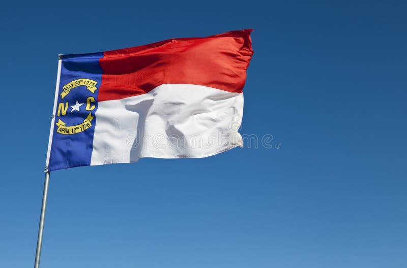 The North Carolina flag blowing in the wind. The North Carolina flag blowing in the wind