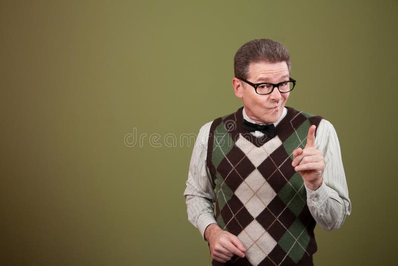 Nerd pointing index finger over green background. Nerd pointing index finger over green background