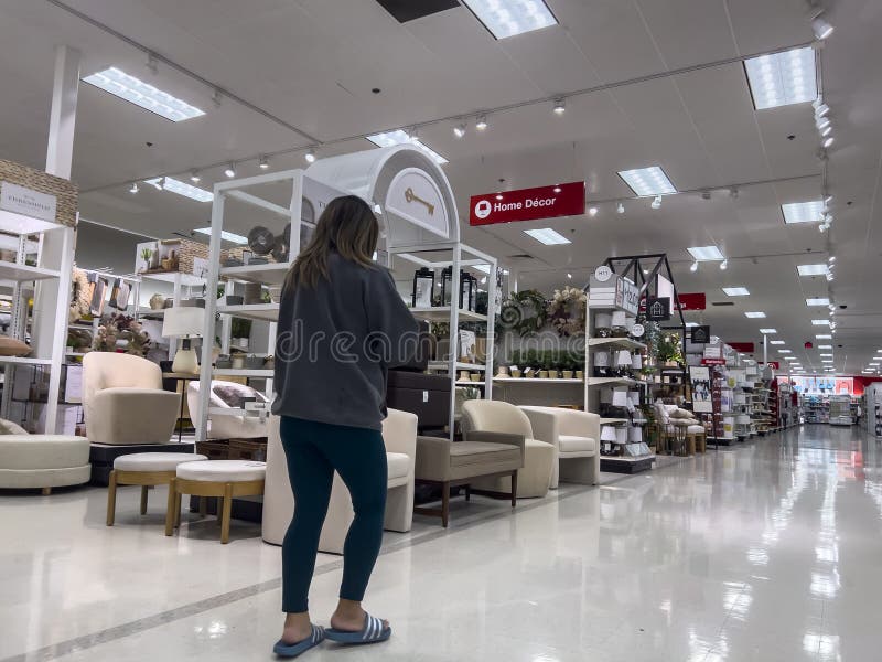 Wide angle view of a woman shopping inside a Target retail store. Wide angle view of a woman shopping inside a Target retail store