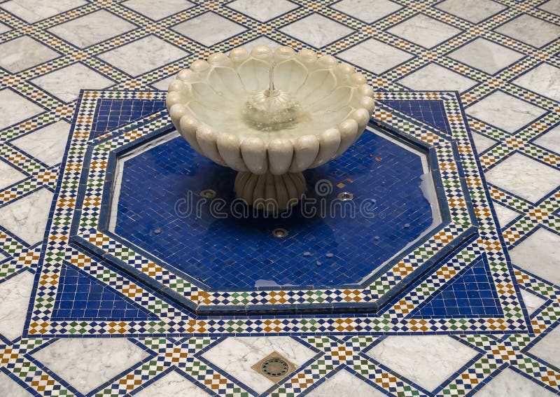 Pictured is a fountain in the courtyard of the Riad Maison Bleue, a luxury boutique hotel in Fes, Morocco. The Riad Maison Bleue was created in a house dating from the 19th century whose former owner, was the late Moulay Bel Arbi El Alaoui, famous judge and professor of theology. Today the luxury boutique hotel it is managed by the El Abbadi`s family. Pictured is a fountain in the courtyard of the Riad Maison Bleue, a luxury boutique hotel in Fes, Morocco. The Riad Maison Bleue was created in a house dating from the 19th century whose former owner, was the late Moulay Bel Arbi El Alaoui, famous judge and professor of theology. Today the luxury boutique hotel it is managed by the El Abbadi`s family.