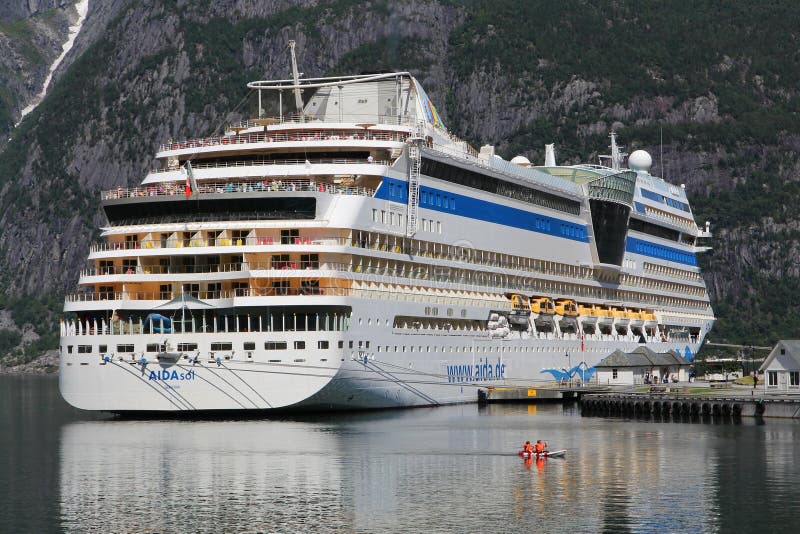 EIDFJORD, NORWAY - JULY 17, 2015: People enjoy their AIDAsol cruise in Norway. AIDA sol was built by Meier Werft in 2011. It can carry 2,174 passengers. EIDFJORD, NORWAY - JULY 17, 2015: People enjoy their AIDAsol cruise in Norway. AIDA sol was built by Meier Werft in 2011. It can carry 2,174 passengers.