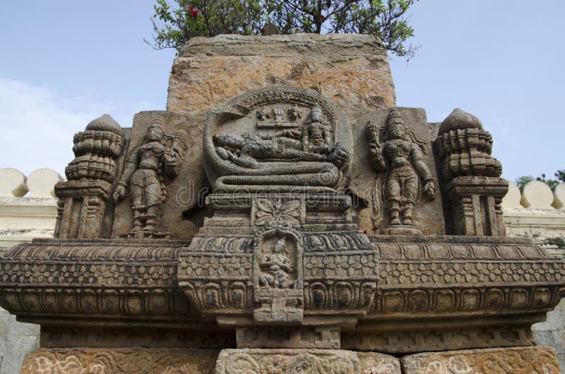 Carved idol on the outer wall of a small temple, Ranganathaswamy Temple, Srirangapatna, Karnataka, India. Carved idol on the outer wall of a small temple, Ranganathaswamy Temple, Srirangapatna, Karnataka, India