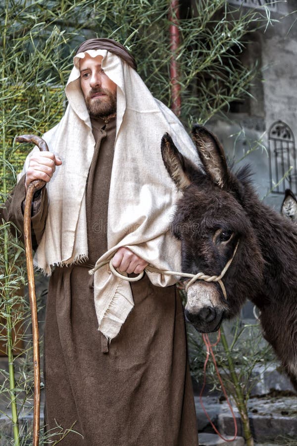 Σκηνή της ζωής του Ιησού Η πτήση στην Αίγυπτο Joseph και ένας γάιδαρος στοκ εικόνα Σκηνή της ζωής του Ιησού Η πτήση στην Αίγυπτο Joseph και ένας γάιδαρος στοκ εικόνα