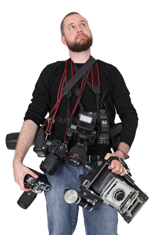 Photo of a man in his late twenties, standing and holding many cameras, film, digital, medium format and large format. Photo of a man in his late twenties, standing and holding many cameras, film, digital, medium format and large format.