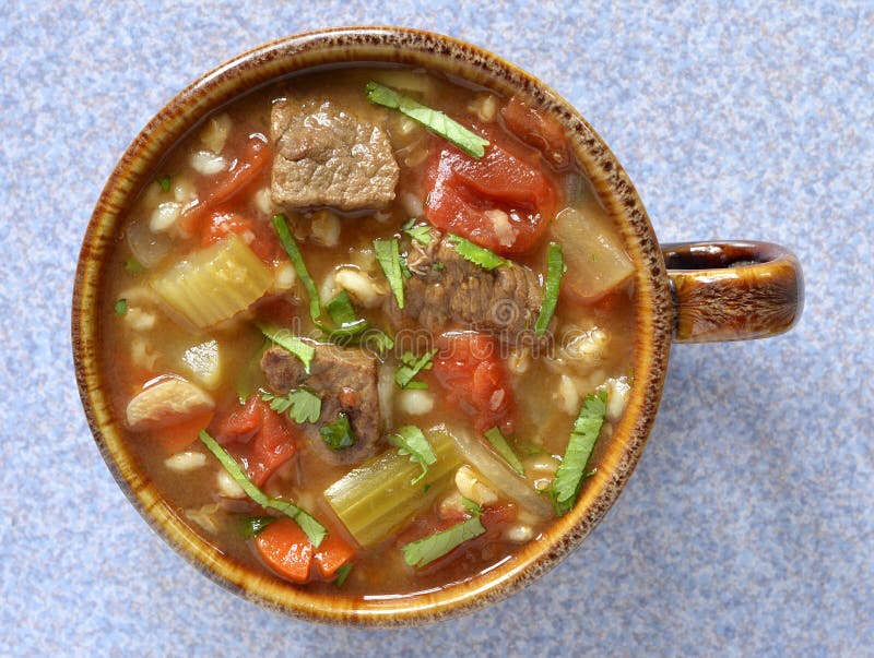 Hearty healthy beef and barley vegetable soup from overhead perspective. Hearty healthy beef and barley vegetable soup from overhead perspective