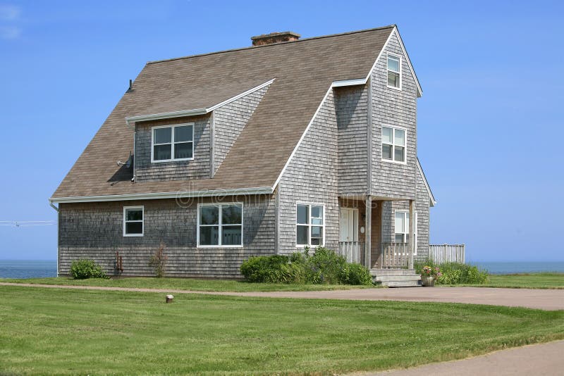 A large modern style new home along the ocean. A large modern style new home along the ocean.