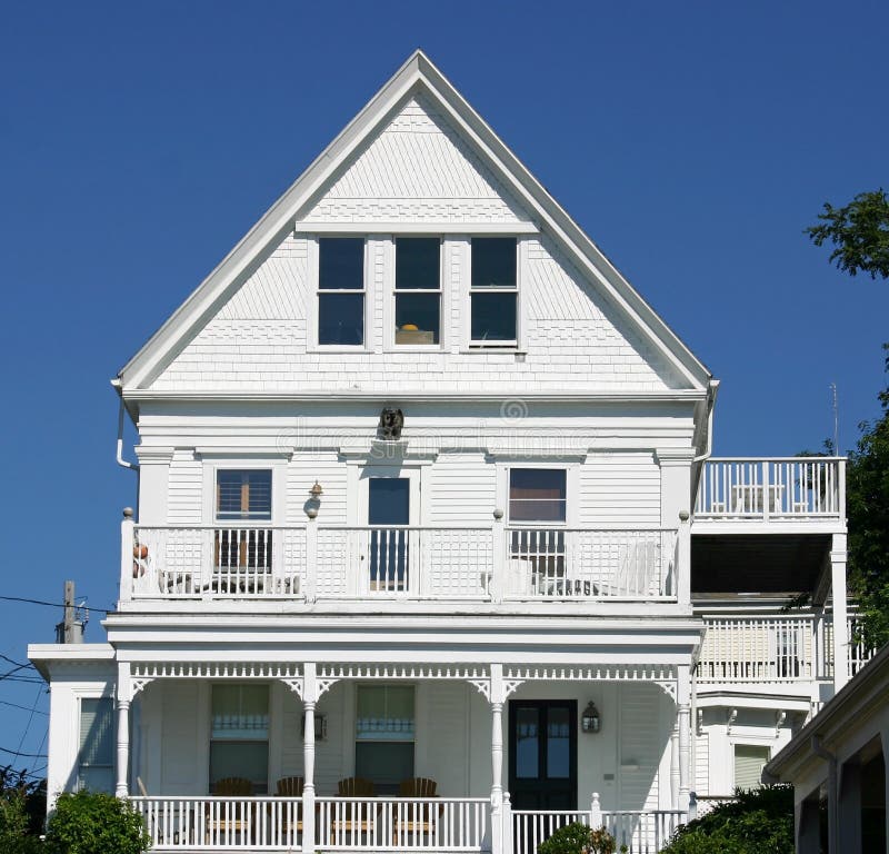 A traditional white Cape Cop House in Provincetown, Massachusetts. A traditional white Cape Cop House in Provincetown, Massachusetts