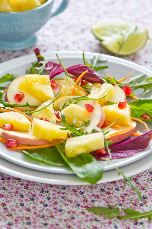 Fresh Pineapple,apple , pomegranate and spinach salad. Fresh Pineapple,apple , pomegranate and spinach salad