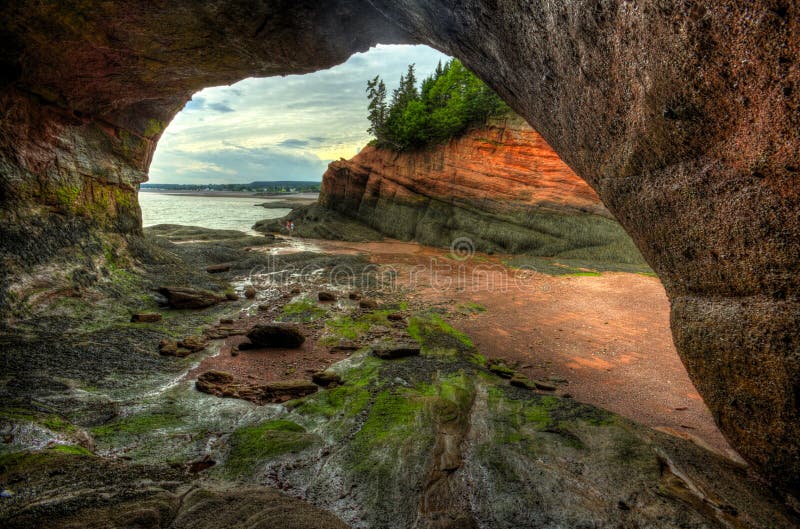 HDR image of caves and coastal features at low tide of the Bay of Fundy at St. Martins, New Brunswick, Canada. HDR image of caves and coastal features at low tide of the Bay of Fundy at St. Martins, New Brunswick, Canada.