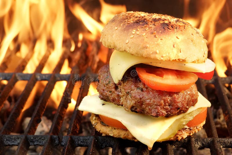 Homemade BBQ Beef Burger On The Hot Flaming Grill. Good Snack For Outdoors Summer Party Or Picnic. Homemade BBQ Beef Burger On The Hot Flaming Grill. Good Snack For Outdoors Summer Party Or Picnic