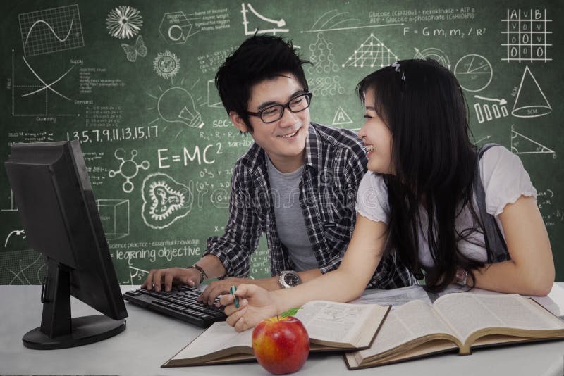 Two asian college students studying together at class. Two asian college students studying together at class